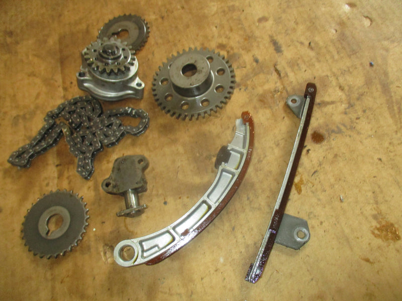Suzuki DF90 outboard timing chain, tensioner, guides and oil pump