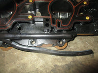Load image into Gallery viewer, Evinrude 150hp 2 stroke outboard intake manifold with reeds (433249) PARTS ONLY

