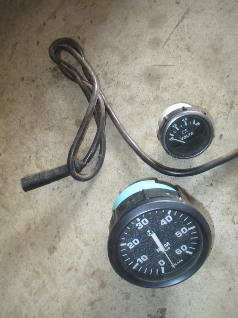 Outboard Faria black tachometer and volt gauge
