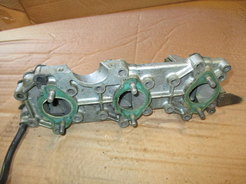 Evinrude 75hp outboard intake manifold w/ reeds (389395)