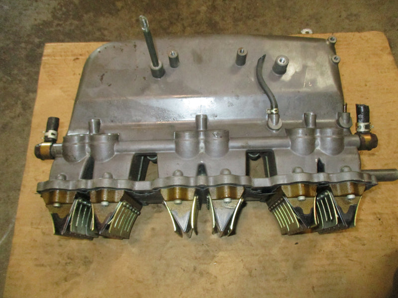Suzuki DT150 outboard intake manifold w/ reeds (13100-88D00)