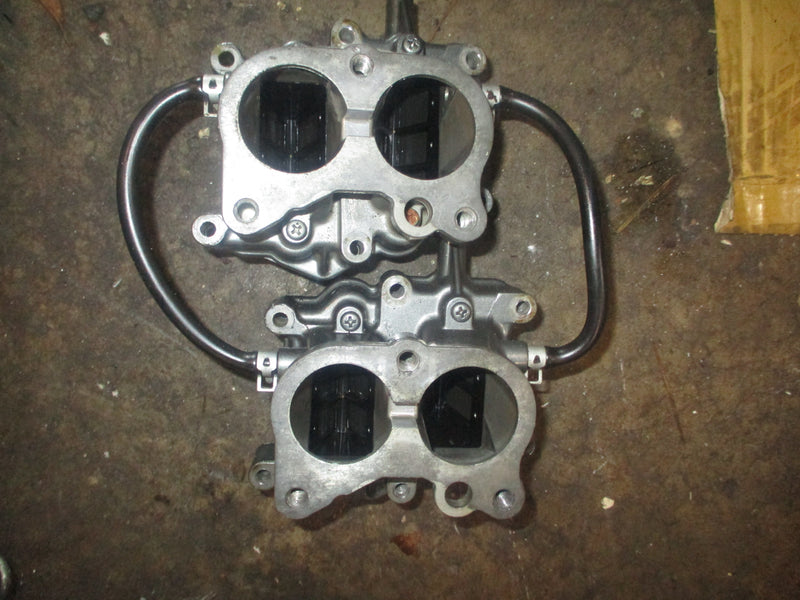 Suzuki DT90 outboard intake manifold w/ reeds (13110-87E20)