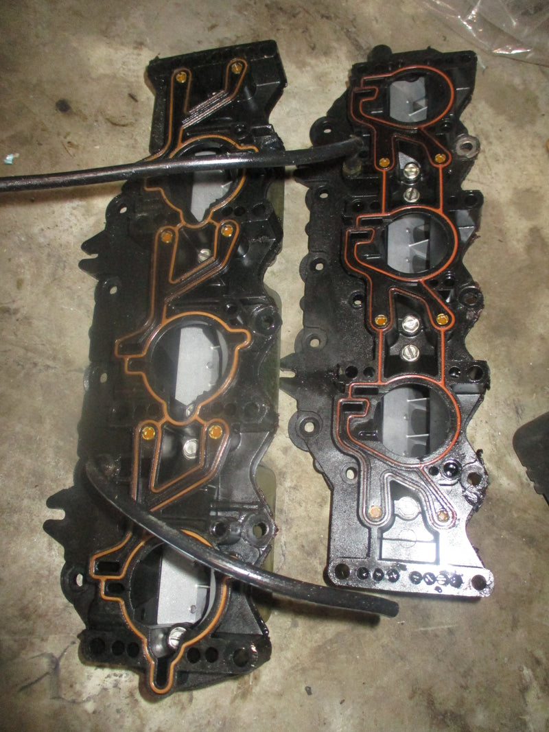 Evinrude 150hp outboard intake manifold w/ reeds (186549)