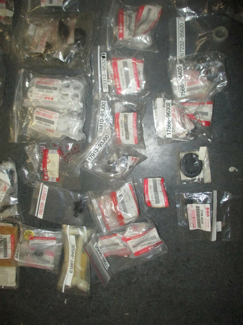 NEW OEM Suzuki outboard a box full of miscellaneous plastic and rubber hardware