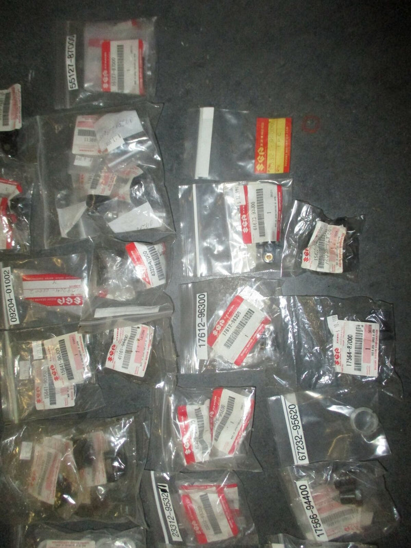 NEW OEM Suzuki outboard a box full of miscellaneous plastic and rubber hardware