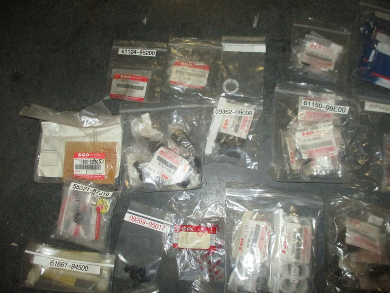 NEW OEM Suzuki outboard a box full of miscellaneous plastic and rubber hardware