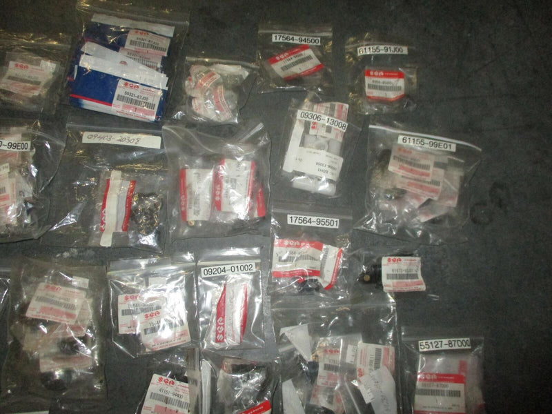 NEW OEM Suzuki outboard a box full of miscellaneous plastic and rubber hardware