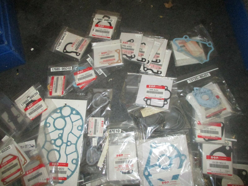 NEW OEM Suzuki outboard miscellaneous small gaskets and water pump plates