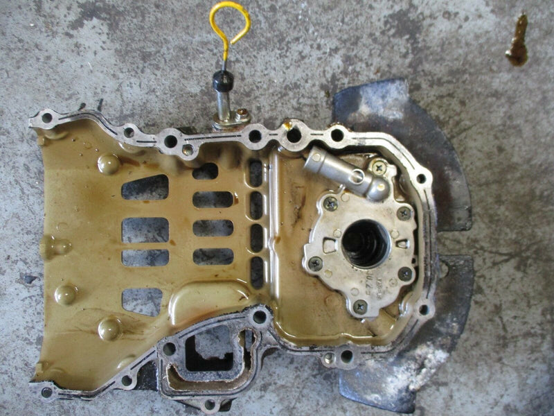 1999 Suzuki DF40 4-stroke outboard engine holder and oil pump 16100-87j11